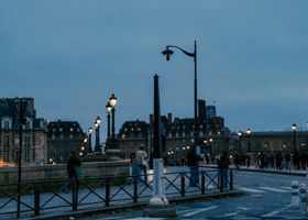 People walking through the city at blue hour